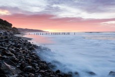 St Clair poles at dawn, St Clair Beach, Dunedin, New Zealand. 