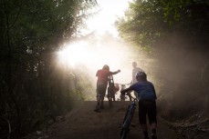 Mountain bike riders Kelly McGarry, Conor Macfarlane and Kepler Rek push up a section on the Queenstown Bike Park at Skyline, Queenstown, New Zealand. 
