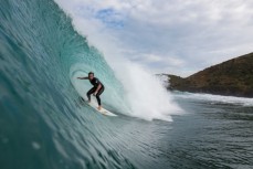 Brtett Wood rides a hollow wave during a surf at a beach in Raglan, Waikato, New Zealand. 