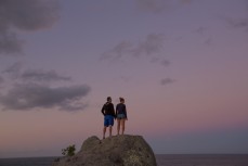 Russian travellers Igor and Maria, both of Moscow, watch dusk fade over the South Pacific at Mount Maunganui, New Zealand. 