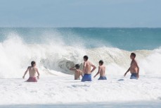 Swimmers in the shorebreak at St Kilda Beach, Dunedin, New Zealand. 