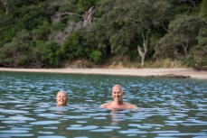 Malcolm and Melanie Rands enjoy a swim at Whale Bay, Northland, New Zealand. 