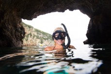Demi Poynter takes a break during a day diving at the Poor Knights Islands 23km off the Tutukaka Coastline, Northland, New Zealand.