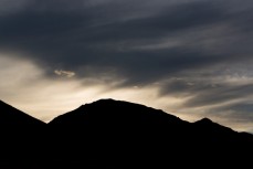 Storm clouds amass over high-country near Omarama, South Canterbury, New Zealand. 