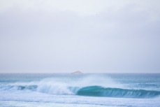A wave peels at a remote beach on the Otago Peninsula, Dunedin, New Zealand. 