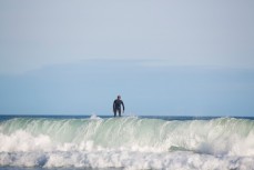 A surfer pulls off a closeout wave at Blackhead Beach, Dunedin, New Zealand. 