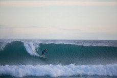 James Murphy, 14, rides a playful wave at Blackhead Beach, Dunedin, New Zealand. 