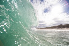 A wave breaks at St Kilda Beach, Dunedin, New Zealand. 
