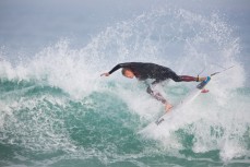 JC Susan airs on a wave at St Kilda Beach, Dunedin, New Zealand. 