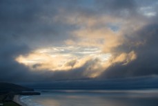 Moody skies over the bay at St Clair, Dunedin, New Zealand. 
