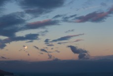 Sunset and moonrise over St Clair Beach, Dunedin, New Zealand. 