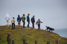 Grommets watch the action from the cliff top during the 2014 South Island Surfing Championships held at Blackhead Beach, Dunedin, New Zealand. 