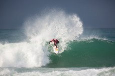 Maz Quinn send spray into the air during the 2014 South Island Surfing Championships held at Blackhead Beach, Dunedin, New Zealand. 
