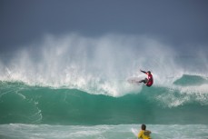 Maz Quinn send spray into the air during the 2014 South Island Surfing Championships held at Blackhead Beach, Dunedin, New Zealand. 