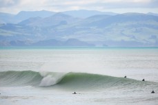 Surfers enjoy offshore conditions at Aramoana, Dunedin, New Zealand. 