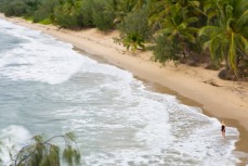 Melissa Findlay stands in the shoreline at Thala Beach, Tropical North Queensland, Queensland, Australia. 