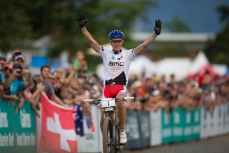 Julien Absalon crosses the finishline in first place after a remarkable race during the 2014 Cairns UCI MTB World Cup held in Tropical North Queensland, Queensland, Australia. 