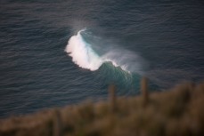 A wave breaks at Allans Beach on Otago Peninsula, Dunedin, New Zealand. 