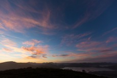 Sunset over Hoopers Inlet on Otago Peninsula, Dunedin, New Zealand. 