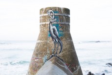 Artwork by Welsh street artist Phlegm adorns the stormwater snorkel at Seconds Beach, Dunedin, New Zealand. 