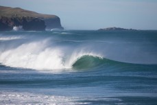 A clean wave rolls into St Clair Beach, Dunedin, New Zealand. 