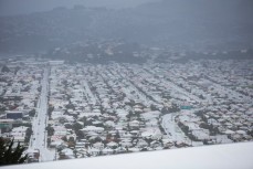 Snow blankets the residential area of South Dunedin, New Zealand. 