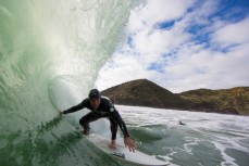 Richie rides a wave at a beachbreak near Raglan, New Zealand. 
