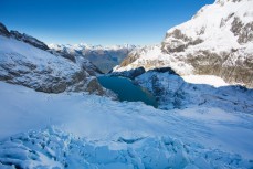 A twist of glaciers converge on an alpine lake in the east of the Darran Mountains, New Zealand. 