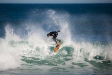 A surfer smashes a closeout section at Blackhead Beach, Dunedin, New Zealand. 