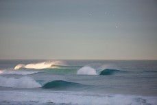 Drainpipes reel into St Clair Beach, Dunedin, New Zealand. 