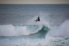 A surfer gets air at St Clair Beach, Dunedin, New Zealand. 