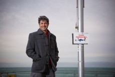 Shark expert Ryan Johnson, of Mossel Bay, South Africa, at the shark bell on St Clair Beach, Dunedin, New Zealand. 