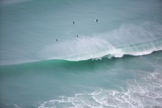 Leroy Rust rides through a tube shortly after the offshore arrived at Aramoana, Dunedin, New Zealand. 