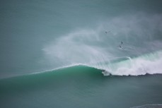 James Steiner weaves inside the barrel at Aramoana, Dunedin, New Zealand. 