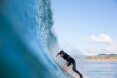 Davy Wooffindin gets tubed in clean surf conditions at Aramoana Beach, Dunedin, New Zealand. 