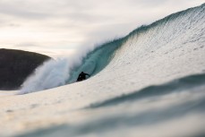 Simon Kaan gets barrelled in clean surf conditions at Aramoana Beach, Dunedin, New Zealand. 