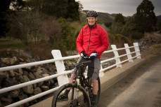 Alan Sutton takes a break on the Waitati Loop, Dunedin, New Zealand. 