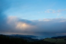 A rain shower passes over Blueskin Bay, Dunedin, New Zealand. 