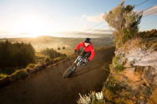Amanda Tulip blasts a trail beneath the gondola at Skyline Rotorua, Rotorua, New Zealand. 