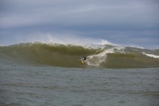 Dale Hunter in the bowels of a large reef wave at the Southern Slab in the Catlins, Southland, New Zealand. 