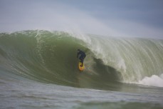 Dale Hunter in the bowels of a large reef wave at the Southern Slab in the Catlins, Southland, New Zealand. 