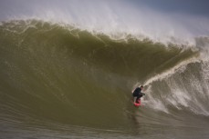 Tom Bracegirdle stalls for a backhand tube at the Southern Slab in the Catlins, Southland, New Zealand. 