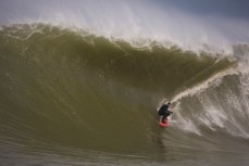 Tom Bracegirdle stalls for a backhand tube at the Southern Slab in the Catlins, Southland, New Zealand. 