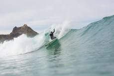 Luke Murphy buries a rail on a wave at Blackhead Beach, Dunedin, New Zealand. 
