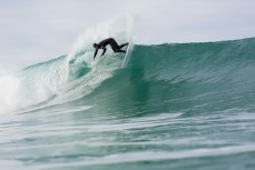 Jamie Civil fins free on a wave at Blackhead Beach, Dunedin, New Zealand. 