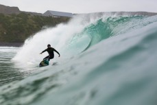 Maz Quinn preparesa to destroy the lip on a wave at Blackhead Beach, Dunedin, New Zealand. 