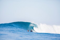 Surfers watch a wave peel through at Salani Rights, Salani, Samoa. 