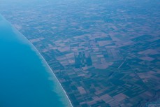 South Pacific Ocean meets the mosaic of farms in South Canterbury, New Zealand. 