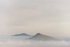 Peaks on Otago Peninsula poke through thick cloud cover, Harbour Cone, Dunedin, New Zealand. 