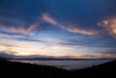 Thick cloud rolls into the low-lying areas of Blueskin Bay, Waitati, Dunedin, New Zealand. 